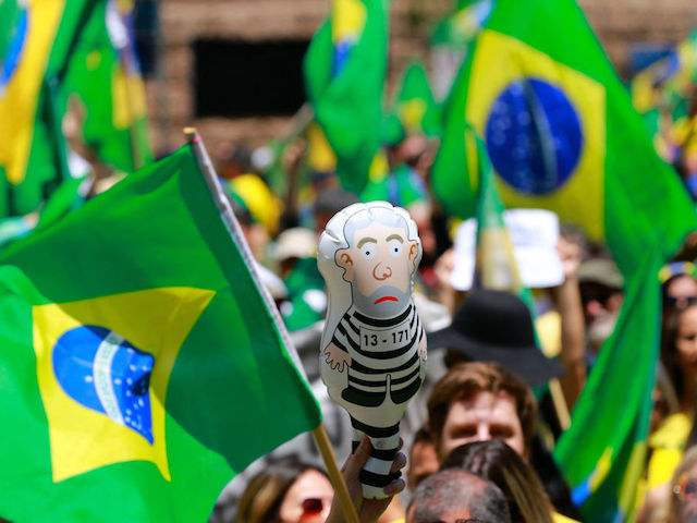 Supporters of Brazilian President Jair Bolsonaro take part in a protest to ask for federal intervention in front of the Army command in Porto Alegre, Rio Grande do Sul, Brazil, on November 2, 2022. - Thousands of Bolsonaristas gathered this Wednesday in front of Army commands in the main cities of Brazil to ask for a military intervention in the face of the victory of leftist Lula da Silva at the polls. (Photo by SILVIO AVILA / AFP) (Photo by SILVIO AVILA/AFP via Getty Images)