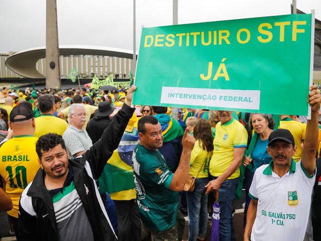 A supporter of Brazilian President Jair Bolsonaro takes part in a protest to ask for federal intervention outside the Army headquarters in Brasilia, on November 2, 2022. - Thousands of Bolsonaristas gathered this Wednesday in front of Army commands in the main cities of Brazil to ask for a military intervention in the face of the victory of leftist Lula da Silva at the polls. (Photo by Sergio Lima / AFP) (Photo by SERGIO LIMA/AFP via Getty Images)