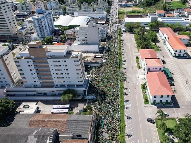 In this aerial view supporters of Brazilian President Jair Bolsonaro take part in a protest to ask for federal intervention in front of the barracks of the 63rd Infantry Battalion in Estreito, in the metropolitan region of Florianopolis, Santa Catarina State, Brazil, on November 2, 2022. - Thousands of Bolsonaristas gathered this Wednesday in front of Army commands in the main cities of Brazil to ask for a military intervention in the face of the victory of leftist Lula da Silva at the polls. (Photo by Anderson COELHO / AFP) (Photo by ANDERSON COELHO/AFP via Getty Images)