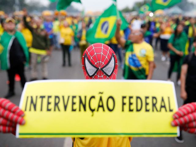 A supporter of Brazilian President Jair Bolsonaro wears a Spider-Man costume as he takes part in a protest to ask for federal intervention outside the Army headquarters in Brasilia, on November 2, 2022. - Thousands of Bolsonaristas gathered this Wednesday in front of Army commands in the main cities of Brazil to ask for a military intervention in the face of the victory of leftist Lula da Silva at the polls. (Photo by Sergio Lima / AFP) (Photo by SERGIO LIMA/AFP via Getty Images)
