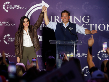 Florida Gov. Ron DeSantis and Anna Paulina Luna are greeted by supporters during a campaign speech during the Unite & Win Rally at the OCC Roadhouse & Museum on November 5, 2022 in Clearwater, Florida. DeSantis continues campaigning against Democratic gubernatorial candidate Charlie Crist ahead of the midterm elections on …