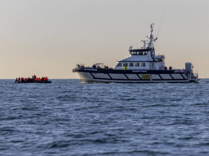 A small boat packed with people is rescued in English waters by BF Defender operated by Border Force and overseen by HMS Severn in the middle of the English Channel on the 13th November 2022 near Folkestone Kent, United Kingdom. Channel Rescue watched from a safe distance as the inflatable …