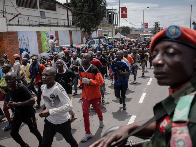 Hundreds of volunteers march to the airport to be directed to a training center after responding to Democratic Republic of Congo's President Felix Tshisekedi's call to join the army to go to the front lines to fight against the M23 rebellion (March 23 Movement) in Goma, Democratic Republic of Congo, on November 14, 2022. (Photo by Guerchom Ndebo / AFP) (Photo by GUERCHOM NDEBO/AFP via Getty Images)