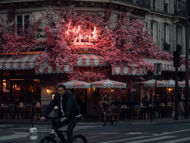 An illuminated sign on the exterior of a bar at dusk in Paris, France, on Monday, Nov. 14,