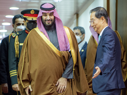 Crown Prince Mohammed bin Salman of Saudi Arabia (L) is welcomed by Prime Minister of South Korea Han Duck-soo (R) with an official ceremony in Seoul, South Korea on November 16, 2022. (Photo by Royal Court of Saudi Arabia / Handout/Anadolu Agency via Getty Images)