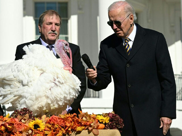 US President Joe Biden pardons Chocolate, the National Thanksgiving Turkey, as he is joined by the National Turkey Federation Chairman Ronnie Parker (L) on the South Lawn of the White House in Washington, DC on November 21, 2022. (Photo by SAUL LOEB / AFP) (Photo by SAUL LOEB/AFP via Getty …