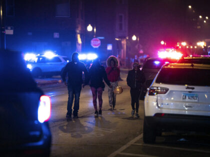 Chicago police and emergency medical responders gather at the scene of a mass shooting on Chicago&apos;s West Side near Polk Street and California Avenue on Oct. 31, 2022.(E. Jason Wambsgans/Chicago Tribune/Tribune News Service via Getty Images)