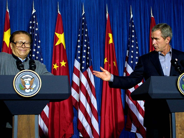 US President George W. Bush (R) introduces Chinese President Jiang Zemin (L) at the beginning of their joint press conference at Bush's ranch near Crawford, Texas, 25 October 2002. Bush and Jiang agreed to face the crisis posed by North Korea's nuclear weapons program together and end it through peaceful means. AFP PHOTO/Paul BUCK (Photo by PAUL BUCK / AFP) (Photo by PAUL BUCK/AFP via Getty Images)