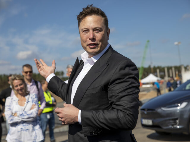 GRUENHEIDE, GERMANY - SEPTEMBER 03: Tesla head Elon Musk talks to the press as he arrives
