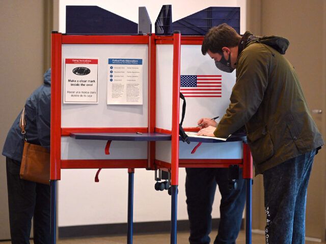 VIRGINIA, UNITED STATES - NOVEMBER 02: Voters cast ballots at a polling location in Arling