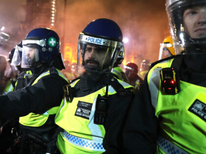 LONDON, ENGLAND - NOVEMBER 05: Protesters clash with riot police officers during the Milli
