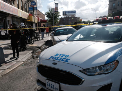 NEW YORK, NEW YORK - JUNE 23: Police gather at the scene of a shooting where an officer wa