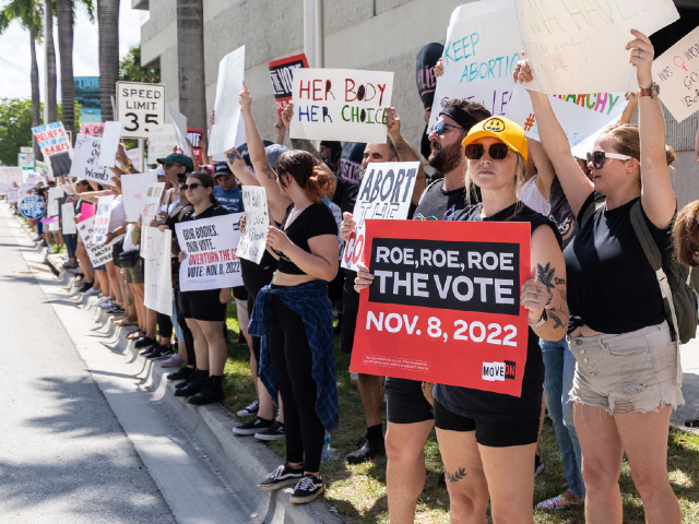 FORT LAUDERDALE, FLORIDA - JULY 13: An abortion rights activist holds a sign at a protest in support of abortion access, March To Roe The Vote And Send A Message To Florida Politicians That Abortion Access Must Be Protected And Defended, on July 13, 2022 in Fort Lauderdale, Florida. (Photo by John Parra/Getty Images for MoveOn)