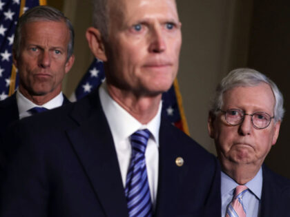 WASHINGTON, DC - SEPTEMBER 13: U.S. Sen. Rick Scott (R-FL) (C) speaks to members of the press as Senate Minority Leader Sen. Mitch McConnell (R-KY) (R) and Senate Minority Whip Sen. John Thune (R-SD) (L) listen after a weekly Republican policy luncheon at the U.S. Capitol September 13, 2022 in …