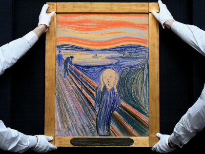 LONDON, ENGLAND - APRIL 12: Gallery technicians at Sotheby's auction house adjust 'The Scream' by Edvard Munch on April 12, 2012 in London, England. The iconic painting is on public exhibition in London for the first time ahead of its auction in the 'Impressionist and Modern Art Evening Sale' at …