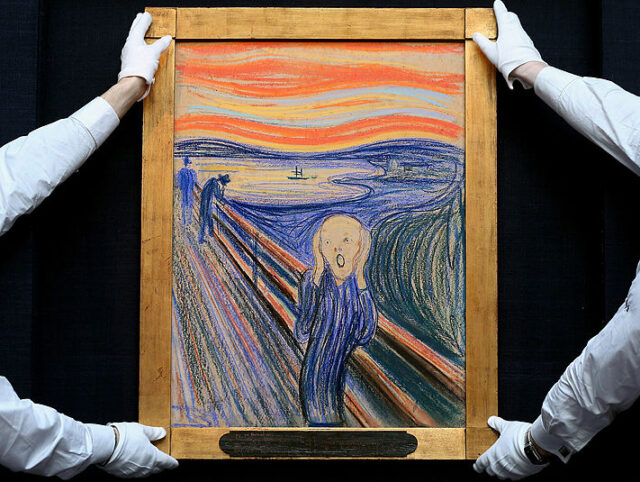 LONDON, ENGLAND - APRIL 12: Gallery technicians at Sotheby's auction house adjust &#