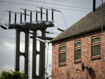 BURTON ON TRENT, ENGLAND - OCTOBER 11: An electricity sub station pylon stands next to a h