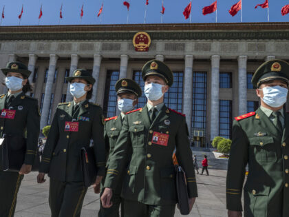 BEIJING, CHINA - OCTOBER 16: Military delegates leave after the Opening Ceremony of the 20th National Congress of the Communist Party of China at The Great Hall of People on October 16, 2022 in Beijing, China. Chinese President Xi Jinping is widely expected to secure a third term in power. …