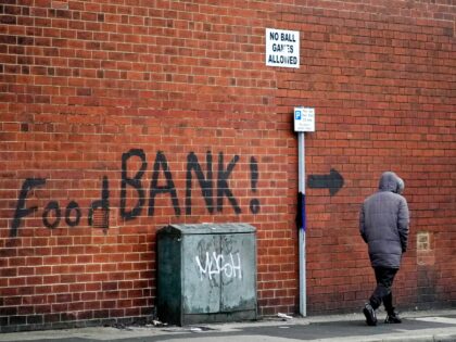 LEEDS, ENGLAND - OCTOBER 21: A sign painted on the side of a house directs people to a local food bank on October 21, 2022 in Leeds, England. A report from the Office for National Statistics (ONS) published earlier this week showed consumer prices index rising to 10.1% in September, …