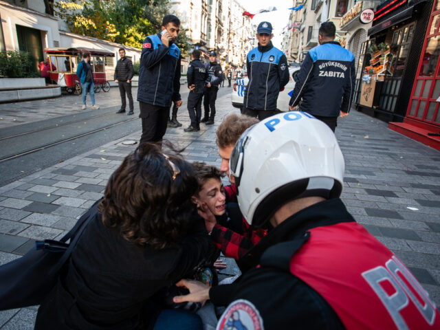 ISTANBUL, TURKEY - NOVEMBER 13: A boy affected by the blast is cared for after an explosio