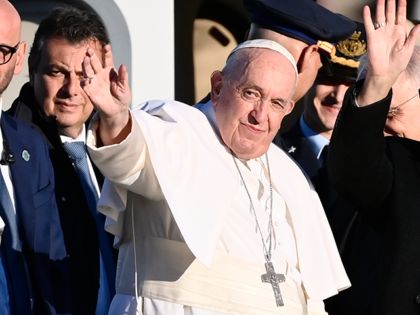 Pope Francis greets faithful before departing aboard a helicopter to return to Vatican City on November 20, 2022 in Asti, Italy. The Pope took a two-day trip to his family’s Italian ancestral region of Piedmont in north-western Italy where, yesterday, he paid a private visit to his relatives in Portacomaro …