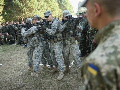YAVOROV, UKRAINE - SEPTEMBER 16: Members of the U.S. Army 173rd Airborne Brigade demonstrate urban warfare techniques as Ukrainian soldiers look on on the second day of the 'Rapid Trident' bilateral military exercises between the United States and Ukraine that include troops from a variety of NATO and non-NATO countries …
