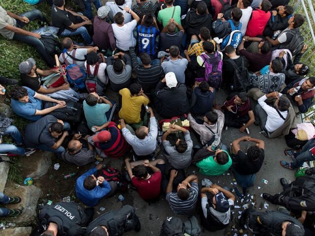 FREILASSING, GERMANY - SEPTEMBER 16: Refugees wait at the German-Austrian border where the