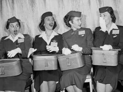 (Original Caption) Muffett Webb, of Dallas, Texas, an air stewardess with the Brainiff International Airways (third from left) surpresses a cry of surprise as she was announced the winner of a contest, first of its kind, to select a "Miss Skyway" from among air stewardesses of the United States. Left …