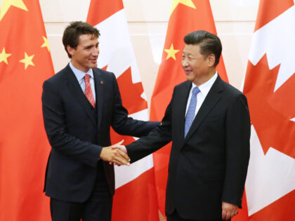 BEIJING, CHINA - AUGUST 31: Chinese President Xi Jinping (R) shakes hands with Canadian P