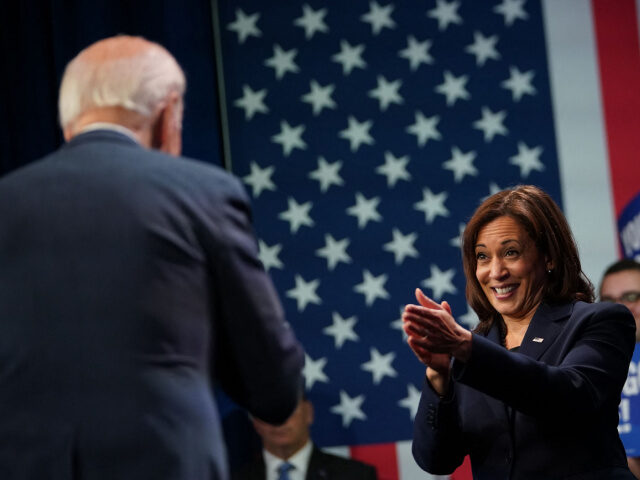 US Vice President Kamala Harris applauds President Joe Biden during an event hosted by the Democratic National Committee to thank campaign workers, at Howard Theatre in Washington, DC, November 10, 2022. (Photo by Mandel NGAN / AFP) (Photo by MANDEL NGAN/AFP via Getty Images