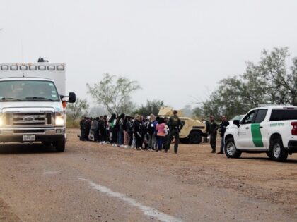 An Eagle Pass Fire Department ambulance departs carrying a deceased Cuban migrant woman who died while crossing the Rio Grande. (Randy Clark/Breitbart Texas)