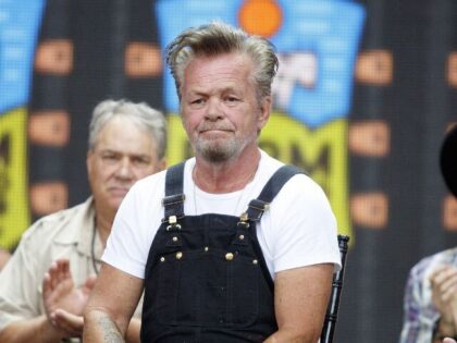 Musician John Mellencamp, center, smiles while being introduced at a news conference during the Farm Aid festival in East Troy, Wisconsin, U.S., on Saturday, Sept. 21, 2019. Since 1985, Farm Aid has raised $57 million to promote a strong and resilient family farm system of agriculture. Photographer: Laura McDermott/Bloomberg via …