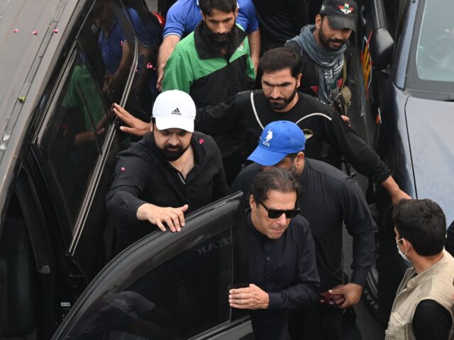 Pakistan's former prime minister Imran Khan (C) arrives to join an anti-government march t