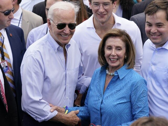 President Joe Biden poses for a photo with House Speaker Nancy Pelosi of Calif., during the Congressional Picnic on the South Lawn of the White House, Tuesday, July 12, 2022, in Washington. (Patrick Semansky/AP)