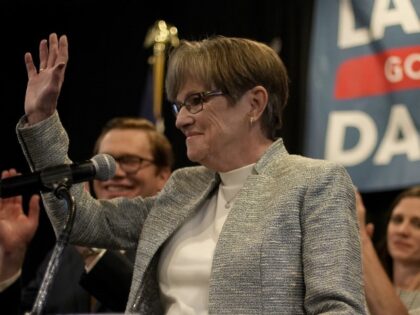 Kansas Gov. Laura Kelly waves to supporters at a watch party after calling it a night with the race too close to call, Wednesday, Nov. 9, 2022, in Topeka, Kansas. Kelly was facing Republican challenger and Kansas Attorney General Derek Schmidt. (Charlie Riedel/AP)