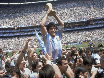 YE Sports Deaths FILE - In this June 29, 1986, file photo, Diego Maradona holds up his team's trophy after Argentina's 3-2 victory over West Germany at the World Cup final soccer match at Azteca Stadium in Mexico City. Sports in 2020 was an unending state of mourning. Maradona died …