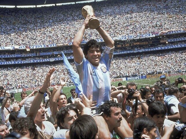 YE Sports Deaths FILE - In this June 29, 1986, file photo, Diego Maradona holds up his tea