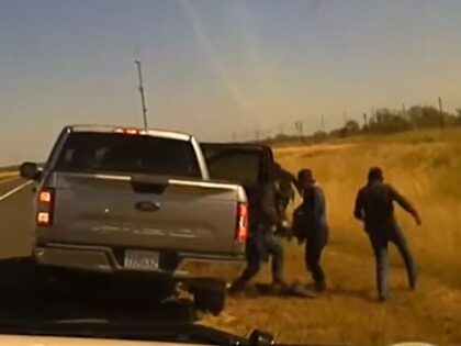 Migrants bail out of a Ford F0150 truck during a human smuggling incident in Zavala County, Texas. (Texas Department of Public Safety Video Screenshot)