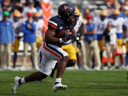 Mike Hollins #7 of the Virginia Cavaliers rushes in the first half during a game at Scott Stadium on November 12, 2022 in Charlottesville, Virginia. Ryan M. Kelly/Getty Images)