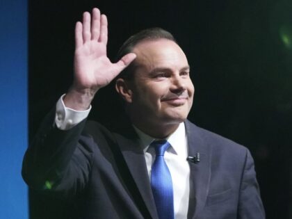 Utah Republican Sen. Mike Lee waves before a televised debate with independent challenger Evan McMullin Monday, Oct. 17, 2022, in Orem, Utah. The race for Utah's U.S. Senate seat is the most competitive the reliably red state has seen in decades. Lee acknowledges that his race with McMullin will likely …