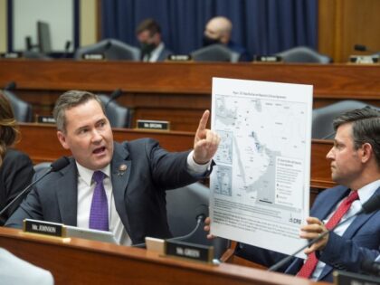 WASHINGTON, DC - SEPTEMBER 29: Rep. Michael Waltz (R-FL) questions the panel while Rep. Mike Johnson (R-LA) holds a map of the Middle East during a House Armed Services Committee hearing on Ending the U.S. Military Mission in Afghanistan in the Rayburn House Office Building at the U.S. Capitol on …