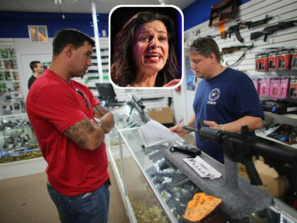 POMPANO BEACH, FL - JANUARY 16: Jonathan Schwartz (R), a salesman at the National Armory gun store, fills out the paperwork for Reese Magnant as he buys a National Armory AR-15 Battle Entry “Assault Rifle” on January 16, 2013, in Pompano Beach, Florida. President Barack Obama today in Washington, DC …