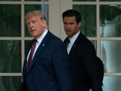 US President Donald Trump, with Director of the White House Presidential Personnel Office John McEntee, walks to the Oval Office as he returns to the White House in Washington, DC, on September 11, 2020. - President Trump traveled to Shanksville, Pennsylvania, to attend the 19th anniversary commemoration for the 9/11 …