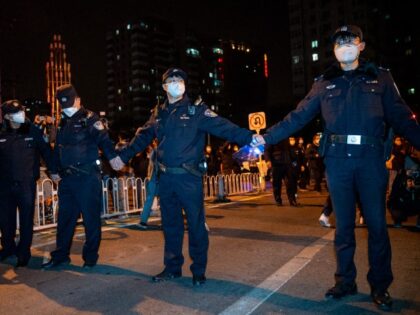 BEIJING, CHINA - NOVEMBER 27: Police officers stand guard during a protest against Zero Covid and epidemic prevention restrictions in Beijing, China, on Sunday, November 27, 2022. (Stringer/Anadolu Agency via Getty Images)