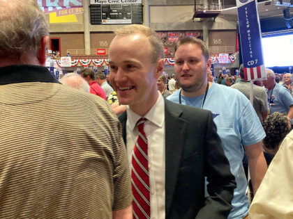 Republican attorney general candidate Jim Schultz greets delegates at the Minnesota Republican State Convention in Rochester, Minn., on Friday, May 13, 2022. Schultz, a hedge fund lawyer, is challenging Democratic Attorney General Keith Ellison. (AP Photo/Steve Karnowski)