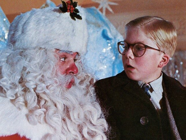 Peter Billingsley sits on Santa's lap in a scene from the film 'A Christmas Stor