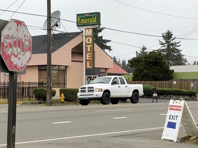Cars drive by the Emerald Motel in North Seattle on Friday, Nov. 11, 2022. Prosecutors say
