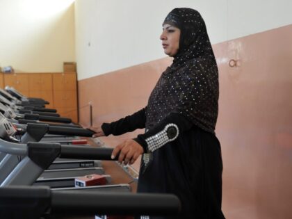 An Afghan woman exercises at a gym in Kabul on October 5, 2011. Women's rights in Afghanistan risk being forgotten as international troops withdraw and the government struggles for a peace deal 10 years after the Taliban were ousted, two charities said. Separate reports by Oxfam and ActionAid say women's …
