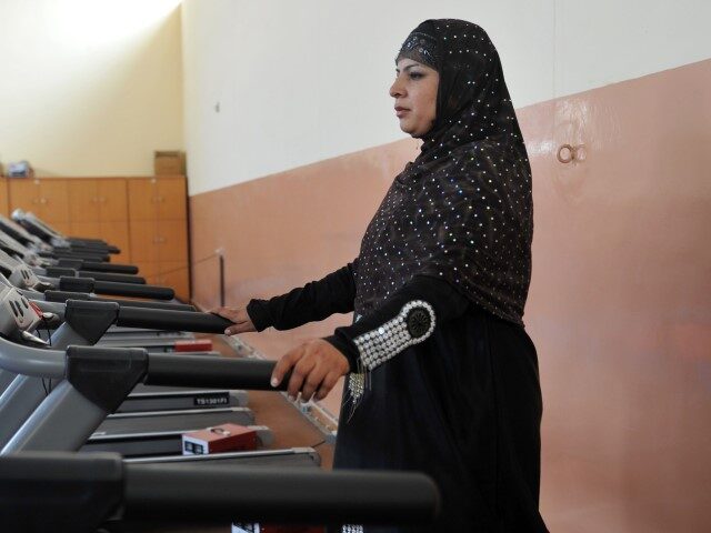 An Afghan woman exercises at a gym in Kabul on October 5, 2011. Women's rights in Afg