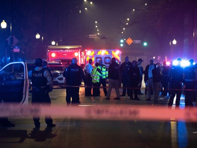 Chicago police and emergency medical responders gather at the scene of a mass shooting on